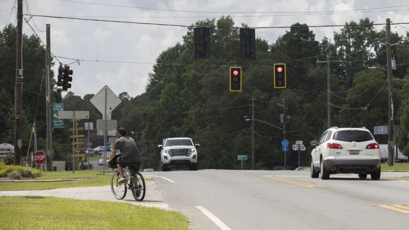 TWIN CITY, GA -- A bicyclist rides in Twin City, a community that could be included on the route of the proposed Georgia Hi-Lo Trail, which would stretch 211 miles through Middle and South Georgia. (AJC Photo/Stephen B. Morton)