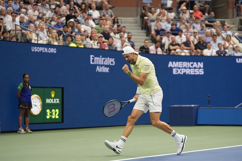 Grigor Dimitrov, of Bulgaria, reacts after scoring a point against Andrey Rublev, of Russia, during the fourth round of the U.S. Open tennis championships, Sunday, Sept. 1, in New York. 2024. (AP Photo/Pamela Smith)