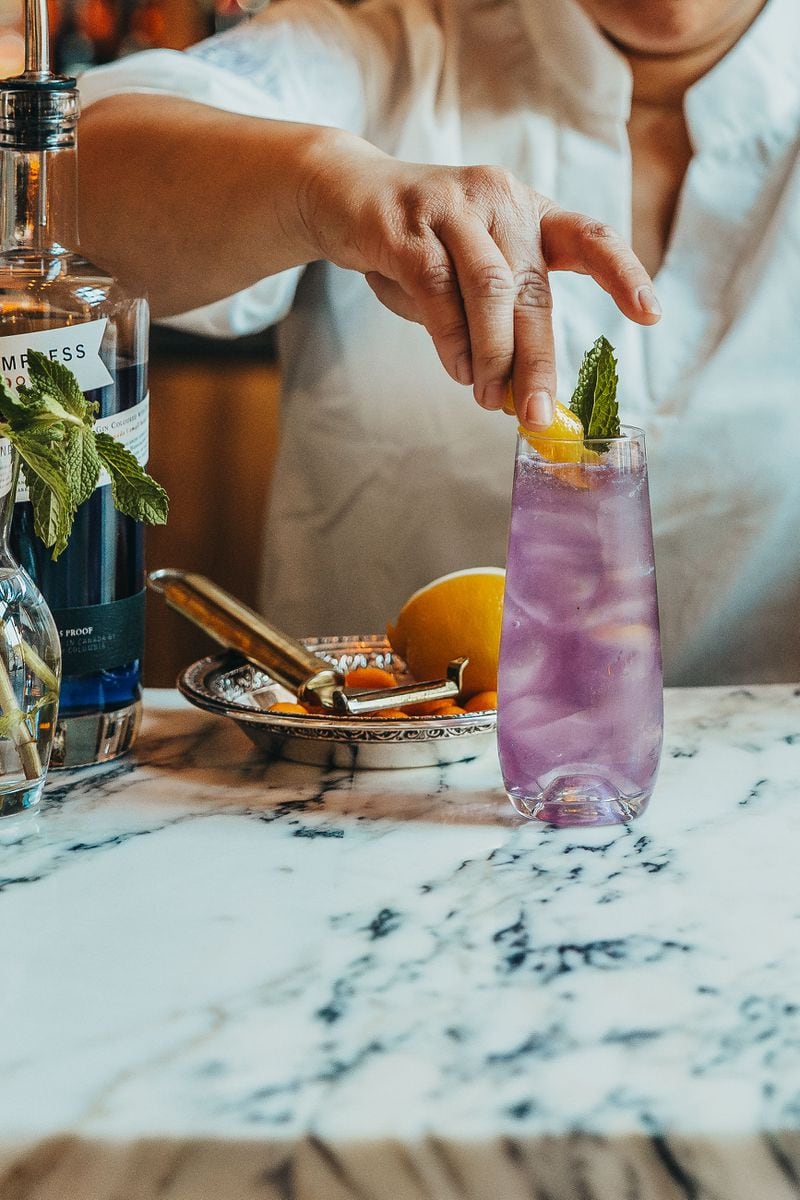 The colorful hue of the en saison at Le Bon Nosh comes from gin infused with butterfly pea flower. Courtesy of Lisbon Racquet Club