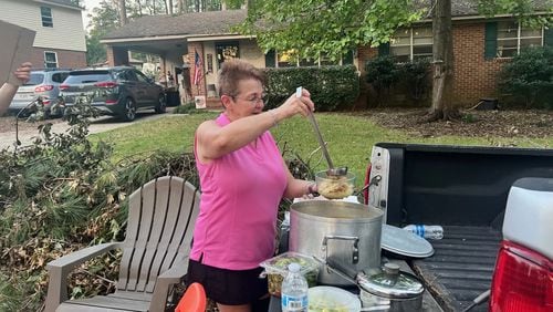 Janice Barrett ladles up soup and gives it to neighbors on Monday, September 30, 2024.  (Photo Courtesy of Charmain Z. Brackett/Augusta Good News)