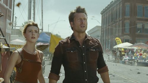 This image released by Universal Pictures shows Glen Powell, right, and Daisy Edgar-Jones in a scene from "Twisters." (Universal Pictures via AP)