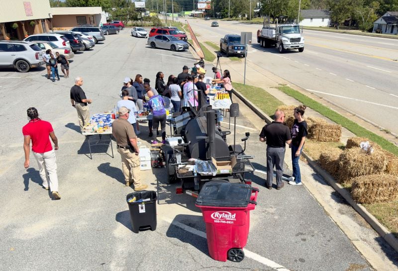 Locals passed out hundred of hot dogs and sausages in rural Washington County on Monday, days after Hurricane Helene left much of the area without power.