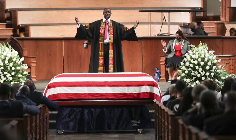 The Rev. Raphael Warnock offers a benediction to close the 2020 funeral services of John Lewis, who was a long-time member of  Ebenezer Baptist Church in Atlanta. Alyssa Pointer / alyssa.pointer@ajc.com