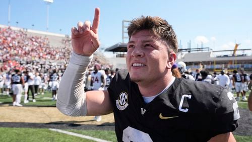 Vanderbilt quarterback Diego Pavia (2) celebrates the team's 34-27 overtime win after an NCAA college football game against Virginia Tech, Saturday, Aug. 31, 2024, in Nashville, Tenn. (AP Photo/George Walker IV)