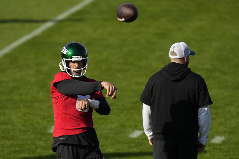 New York Jets quarterback Aaron Rodgers (8) participates in a training session in Ware, England, Friday, Oct. 4, 2024, ahead of the game between New York Jets and Minnesota Vikings at the Tottenham Hotspur stadium on Sunday. (AP Photo/Alastair Grant)