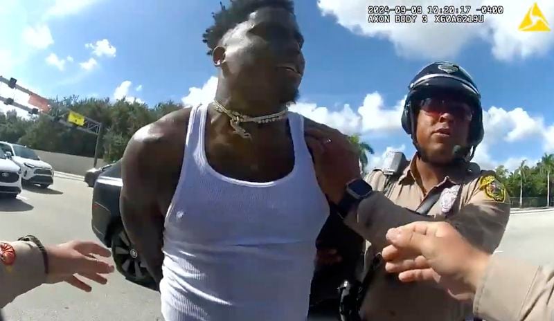 This body cam image released by the Miami-Dade Police Department shows Miami Dolphins receiver Tyreek Hill being arrested during a traffic stop, Sunday, Sept. 8, 2024. (Miami-Dade Police Department via AP)