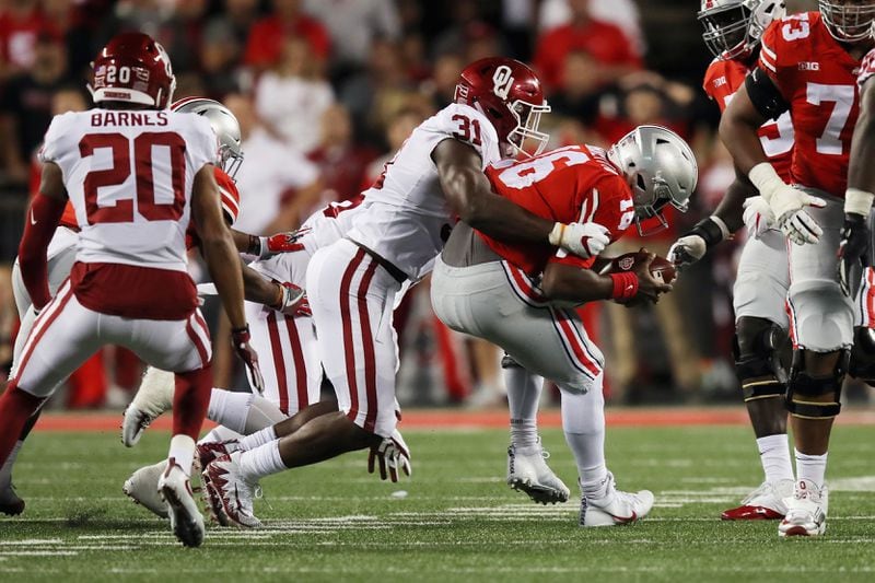 COLUMBUS, OH - SEPTEMBER 09:  J.T. Barrett #16 of the Ohio State Buckeyes is sacked by Ogbonnia Okoronkwo #31 of the Oklahoma Sooners during the first half at Ohio Stadium on September 9, 2017 in Columbus, Ohio.  (Photo by Gregory Shamus/Getty Images)
