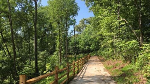 Cobb County is studying three trail projects, including a pedestrian bridge that would extend the Noonday Creek Trail over Cobb Parkway. AJC FILE