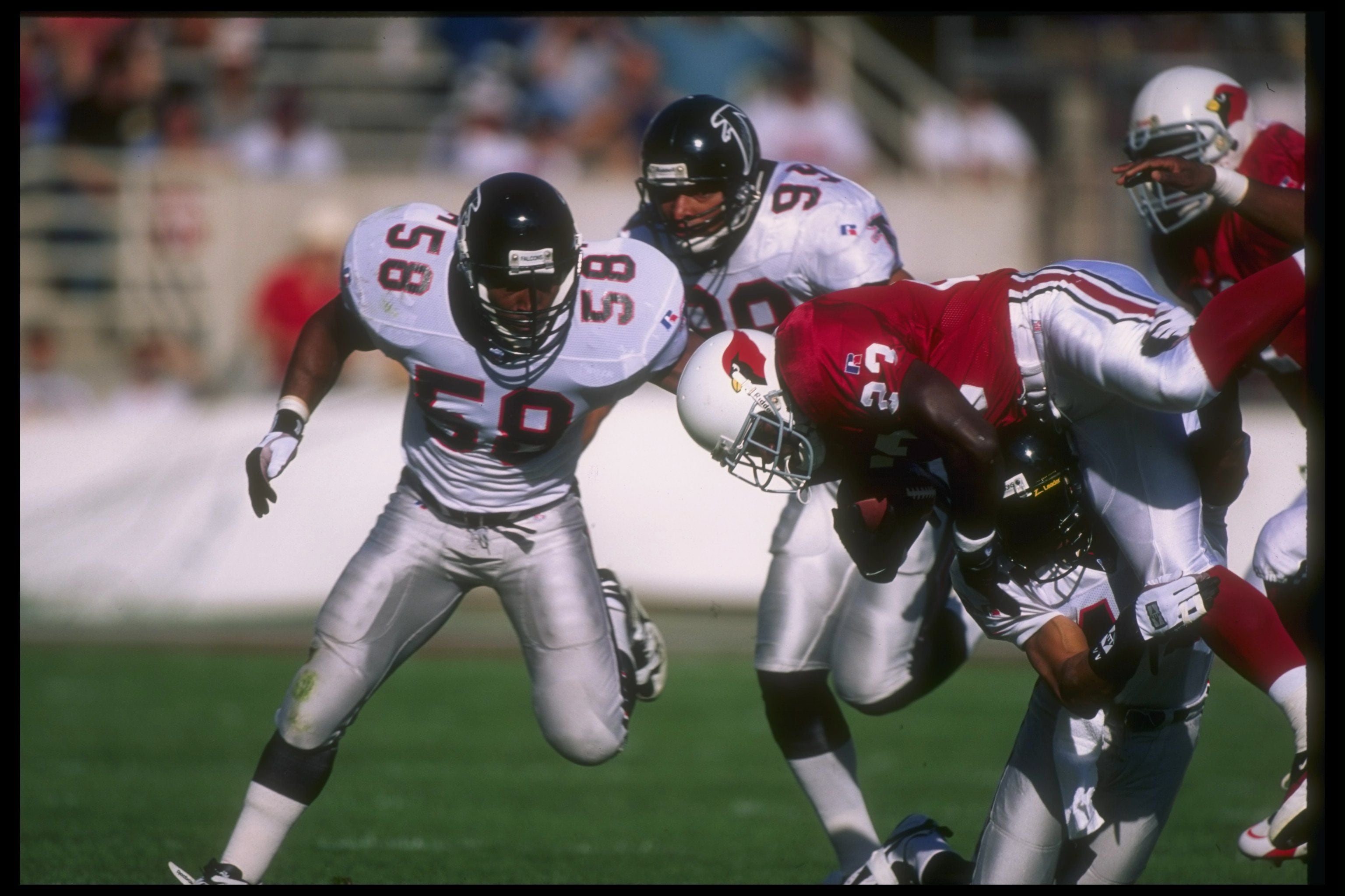 Atlanta Falcons' Jessie Tuggle dresses up as a tarantula football