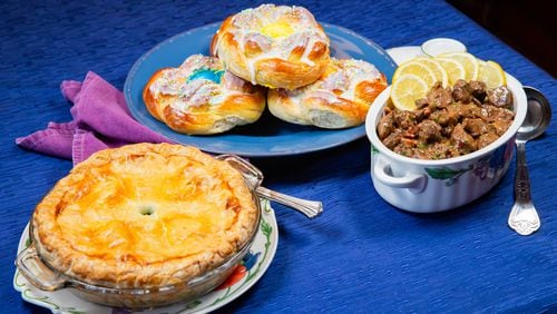 Three traditional Italian Easter dishes, from left: Torta Pasqualina (Easter Pie), Pane di Pasqua (Easter Bread), and Agnello Brodettato (Lamb Stew). Styling by Cynthia Graubart. (RYAN FLEISHER FOR THE ATLANTA JOURNAL-CONSTITUTION)