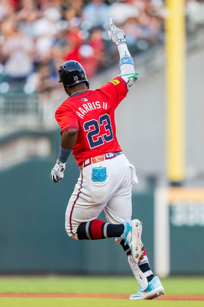 Atlanta Braves' Michael Harris II rounds second and waves to the crowd after hitting a home run in the first inning of a baseball game against the Washington Nationals, Friday, Aug. 23, 2024, in Atlanta. (AP Photo/Jason Allen)