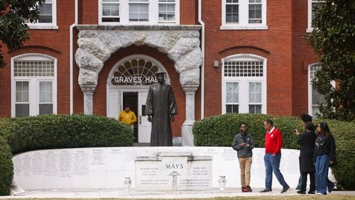 A tour guide ushers prospective students on March 18 near the Benjamin E. Mays Memorial in front of Graves Hall on the Morehouse College campus in Atlanta. (Jason Getz/The Atlanta Journal-Constitution/TNS)