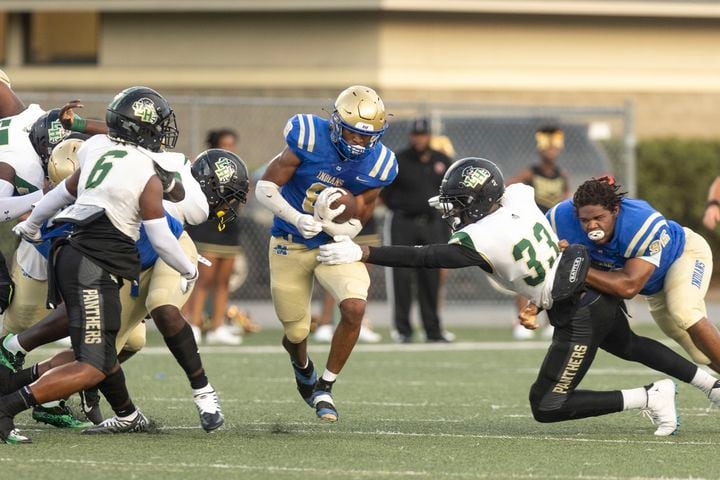 McEachern’s Jaylon Brown (8) runs the ball during a GHSA High School football game between Langston Hughes High School and McEachern High School at McEachern High School in Powder Springs, GA., on Friday, August 26, 2022. (Photo by Jenn Finch)