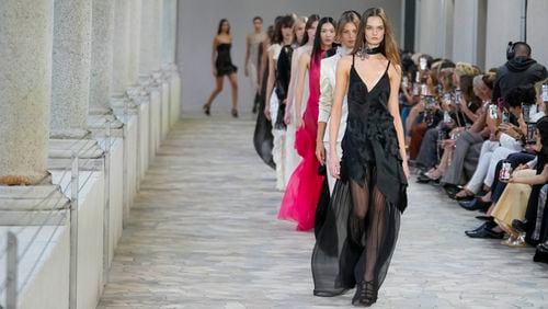 Models wear creations as part of the Alberta Ferretti Spring Summer 2025 collection, that was presented in Milan, Italy, Tuesday, Sept. 17, 2024. (AP Photo/Luca Bruno).