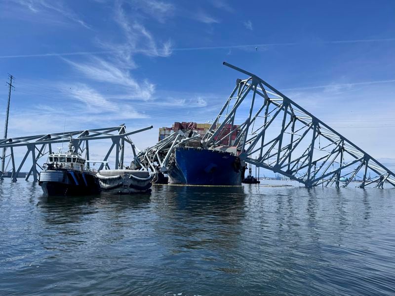 The fallen Francis Scott Key Bridge in Baltimore is pictured Sunday, March 31, 2024, where divers assisted crews with the complicated and meticulous operation of removing steel and concrete. (AP Photos/Mike Pesoli, File)