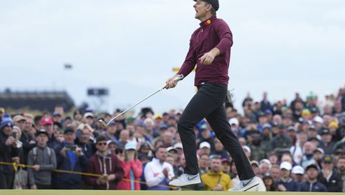 Justin Rose of England reacts after missing a putt on the 12th green during his final round of the British Open Golf Championships at Royal Troon golf club in Troon, Scotland, Sunday, July 21, 2024. (AP Photo/Jon Super)