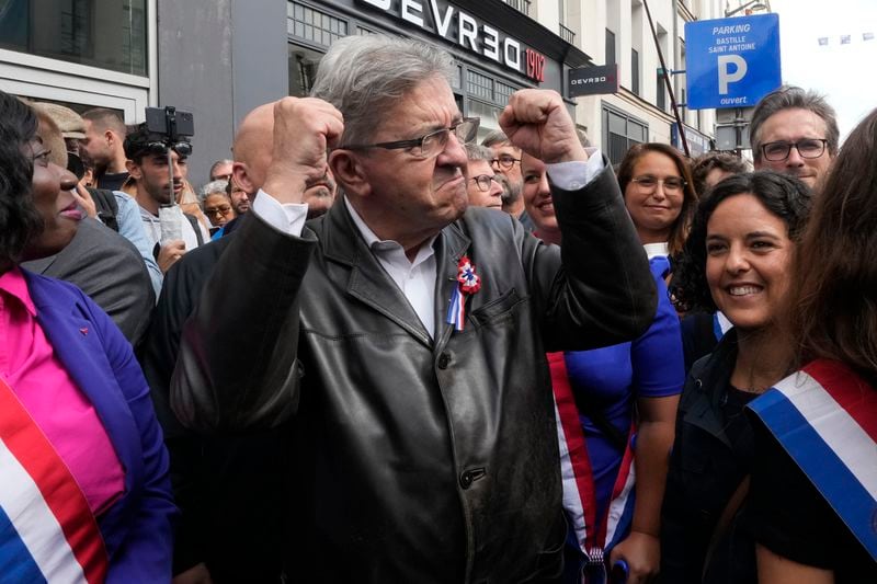 France Unbowed leader Jean-Luc Melenchon, center, who criticized as a power grab the president's appointment of a conservative new prime minister, Michel Barnier, gestures as he participates in a protest demonstration in Paris, France, Saturday, Sept. 7, 2024. (AP Photo/Michel Euler)