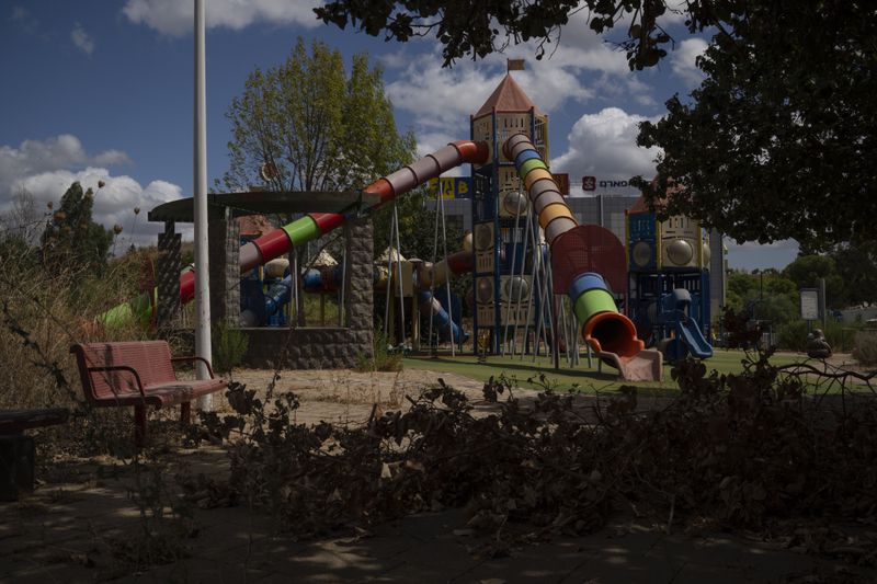 A playground is seen on a square in Kiryat Shmona, a city located next to the border with Lebanon, northern Israel, Tuesday, Sept. 17, 2024. (AP Photo/Leo Correa)