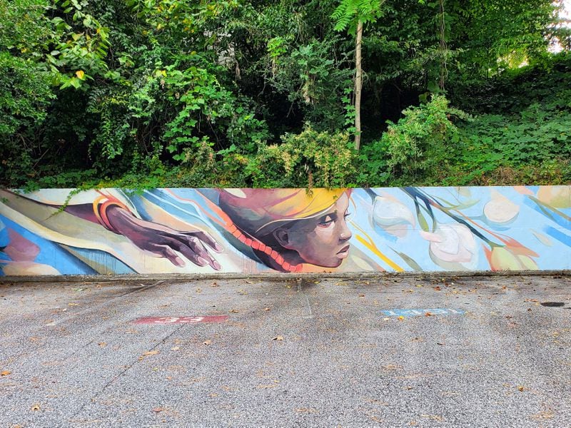 “Evanesce," by illustrator, fine artist and muralist Trudy Tran, surprises customers parking behind the Sam Flax art supply store on Northside Drive. Courtesy of Arthur Rudick