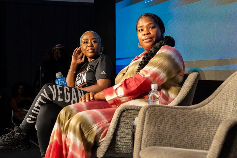 Pinky Cole (left), founder of Slutty Vegan, and Jasmine Crowe-Houston (center, CEO and Founder of Goodr) prepare to speak on a panel of Black business owners at The Gathering Spot in Atlanta on Tuesday, Aug. 27, 2024. (Olivia Bowdoin for the AJC).