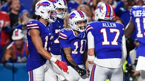 Buffalo Bills wide receiver Khalil Shakir (10) celebrates his touchdown catch with teammates during the first half of an NFL football game against the Jacksonville Jaguars, Monday, Sept. 23, 2024, in Orchard Park, NY. (AP Photo/Adrian Kraus)