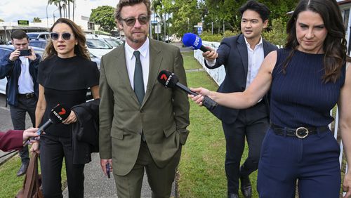 Australian actor and director Simon Baker, center, best known for his role as Patrick Jane in the CBS drama series The Mentalist, arrives at the Mullumbimby Court House, Wednesday, Sept. 11, 2024, for his sentencing hearing for driving under the influence of alcohol near his rural home. (Darren England/AAP Image via AP)