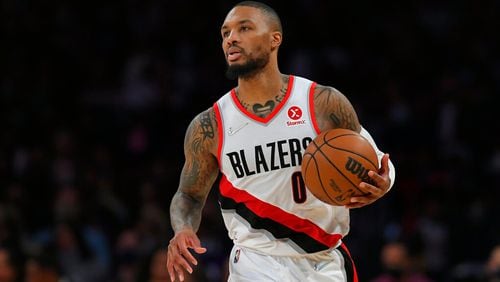 Portland Trail Blazers guard Damian Lillard (0) seen playing the Los Angeles Lakers in an NBA basketball game, Friday Dec. 31, 2021, in Los Angeles. (AP Photo/John McCoy)