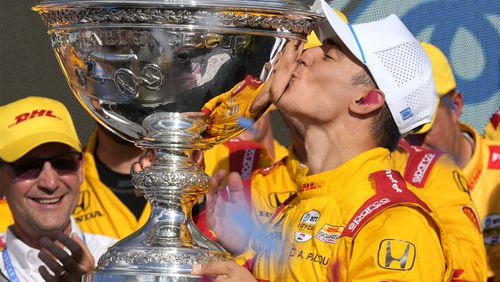 Chris Buescher (17) celebrates winning a NASCAR Cup Series auto race, Sunday, Sept. 15, 2024, in Watkins Glen, N.Y. (AP Photo/Lauren Petracca)