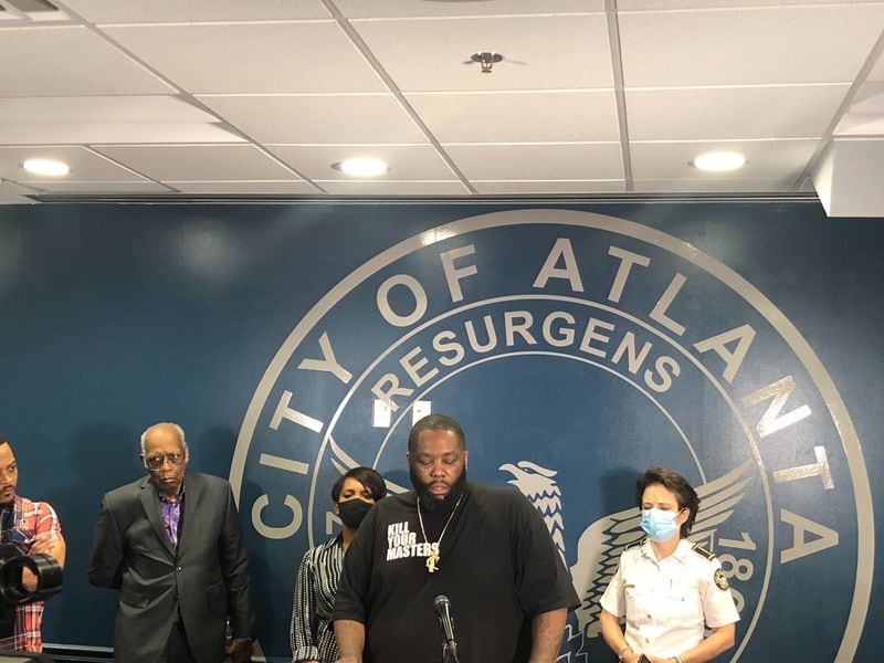 Rapper Killer Mike speaks Friday night during a news conference with Atlanta Mayor Keisha Lance Bottoms.