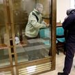 In this photo released by the Moscow City Court Press Service, Stephen Hubbard, a U.S. citizen accused of fighting as a mercenary in Ukraine against Russia stands in a glass cage during a court session in the Moscow City court in Moscow, Russia, Monday, Oct. 7, 2024. (Moscow City Court Press Service via AP)