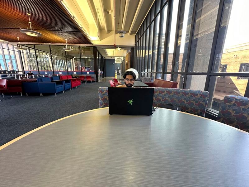 YM Masood, 20, a political science major, studies for the LSAT law school entrance exam Wednesday, July 31, 2024, at the University of Illinois Chicago, where he is a student. (AP Photo/Martha Irvine)