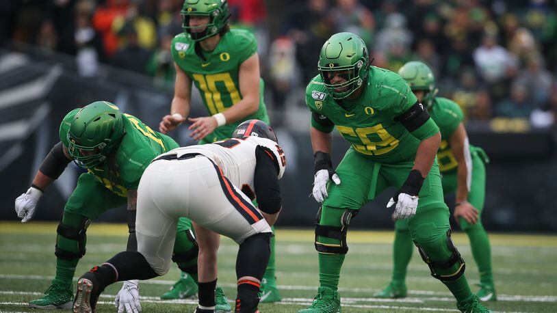 Penei Sewell of the Oregon Ducks looks on against the Washington