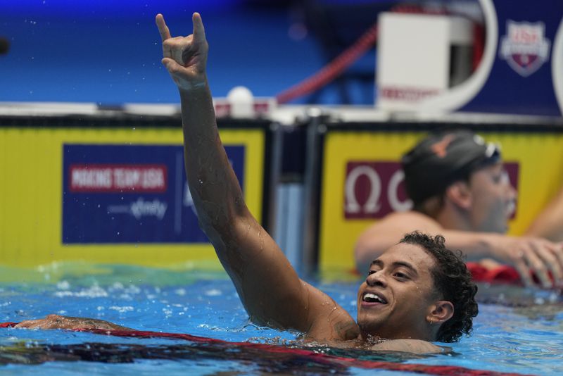 Shaine Casas celebrates after the Men's 200 individual medley finals Friday, June 21, 2024, at the US Swimming Olympic Trials in Indianapolis. (AP Photo/Michael Conroy)