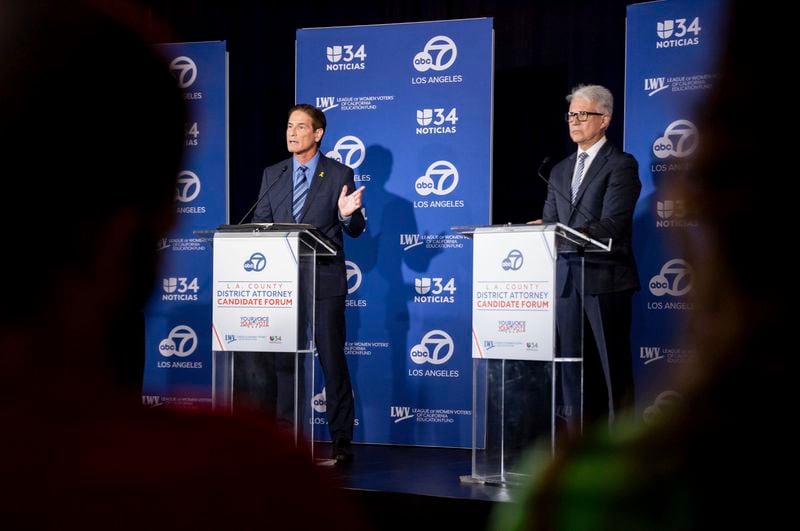 Former federal prosecutor Nathan Hochman, left, and incumbent Los Angeles County District Attorney George Gascón speak during the 2024 Los Angeles County district attorney candidate forum in Los Angeles, Sunday, Sept. 29, 2024. (AP Photo/Ethan Swope)