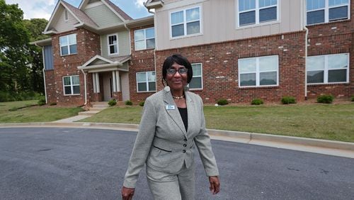 051721 LAWRENCEVILLE: Canary Gordon, 72, walks outside her new Thompson Square public housing unit on Monday, May 17, 2021, in Lawrenceville.     “Curtis Compton / Curtis.Compton@ajc.com”