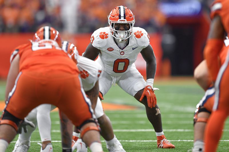 FILE - Clemson linebacker Barrett Carter (0) lines up during the first half of an NCAA college football game against Syracuse in Syracuse, N.Y., Saturday, Sept. 30, 2023. (AP Photo/Adrian Kraus, File)