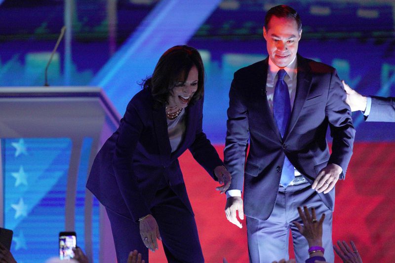 FILE - Democratic presidential candidates Sen. Kamala Harris, D-Calif., left, and former Housing Secretary Julian Castro greet supporters, Sept. 12, 2019, during a Democratic presidential primary debate in Houston. (AP Photo/David J. Phillip, File)