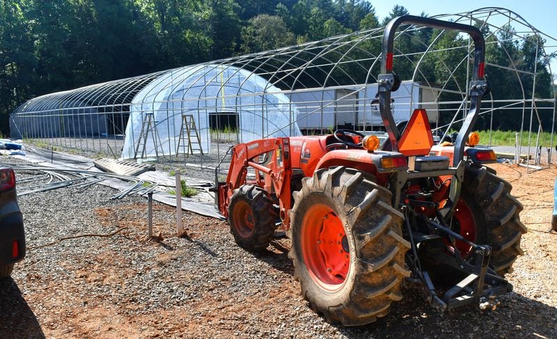 One of the projects underway at Ellijay Mushrooms' farm is the construction of new bigger and taller greenhouses for the mushrooms. As co-owner Howard Berk described, they learned early on that shorter greenhouses held way too much heat inside, which was not conducive to the dark, moist, cool environment that mushrooms require. (Chris Hunt for The Atlanta Journal-Constitution)