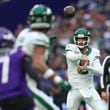 New York Jets quarterback Aaron Rodgers throws during the first half of an NFL football game against the Minnesota Vikings, Sunday, Oct. 6, 2024, at the Tottenham Hotspur stadium in London. (AP Photo/Ian Walton)