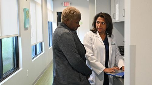 Dr. Anu Sheth (right) checks her daily schedule with Kelsey Harper-Neely, medical assistant, before the opening of the pediatric clinic at Pediatric Associates of Lawrenceville, Wednesday, August 9, 2023, in Lawrenceville. In June, 63,000 Georgia children lost Medicaid because the state did not receive the required application forms to keep them enrolled. Dr. Sheth's practice has already had parents show up for their child's appointment not knowing they were no longer insured because they needed to re-apply. (Hyosub Shin / Hyosub.Shin@ajc.com)