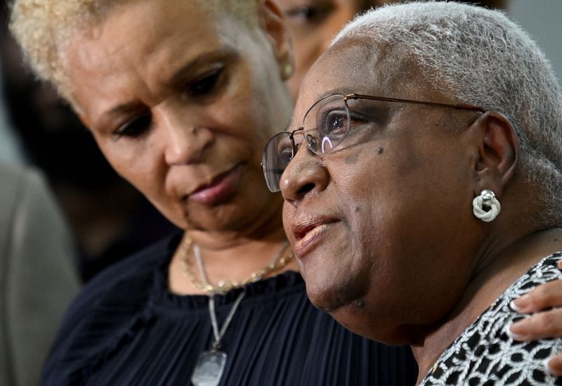 Jonia Milburn (left), mother of Christon Collins, comforts Onnie Smith, mother of John Robert Smith, as Smith speaks to members of the press during a press conference on Tuesday, August 6, 2024 in Atlanta. The family of Christon Collins hold a press conference with attorney Ben Crump. Collins, a veteran, was found dead in the DeKalb County Jail on March 13. His mother has obtained video footage that shows her son was lying on the floor for hours before jail staff responded. John Robert Smith, 58, was also shot and killed in the VA hospital emergency room Monday night where he had sought help for his mental illness. (Hyosub Shin / AJC)