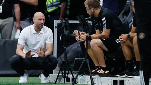 Atlanta United head coach Rob Valentino speaks with his staff during the second half at Mercedes-Benz Stadium on Sunday, August 4, 2024, in Atlanta.
(Miguel Martinez/ AJC)