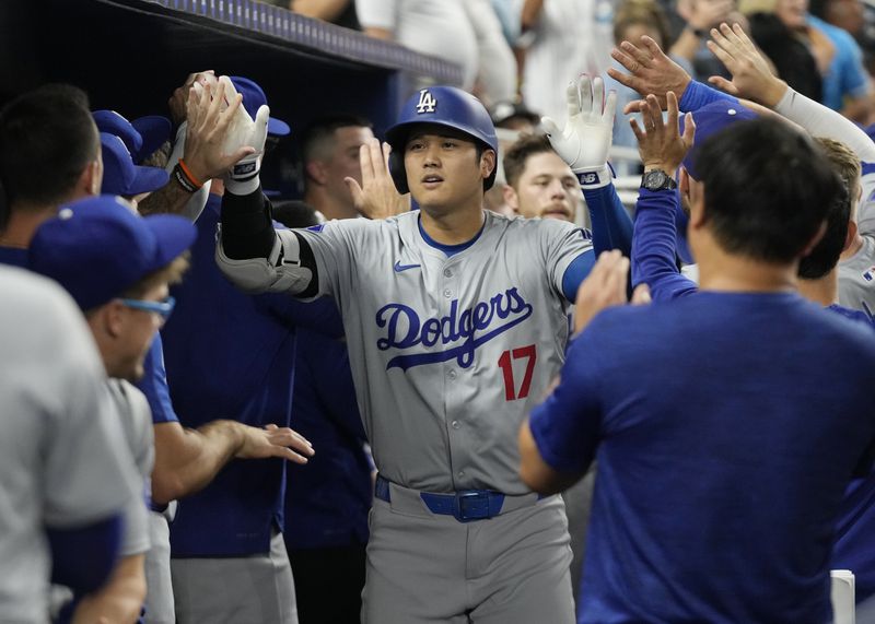 Los Angeles Dodgers' Shohei Ohtani (17) celebrates after hitting a two-run home run during the third inning of a baseball game against the Miami Marlins, Tuesday, Sept. 17, 2024, in Miami. (AP Photo/Marta Lavandier)