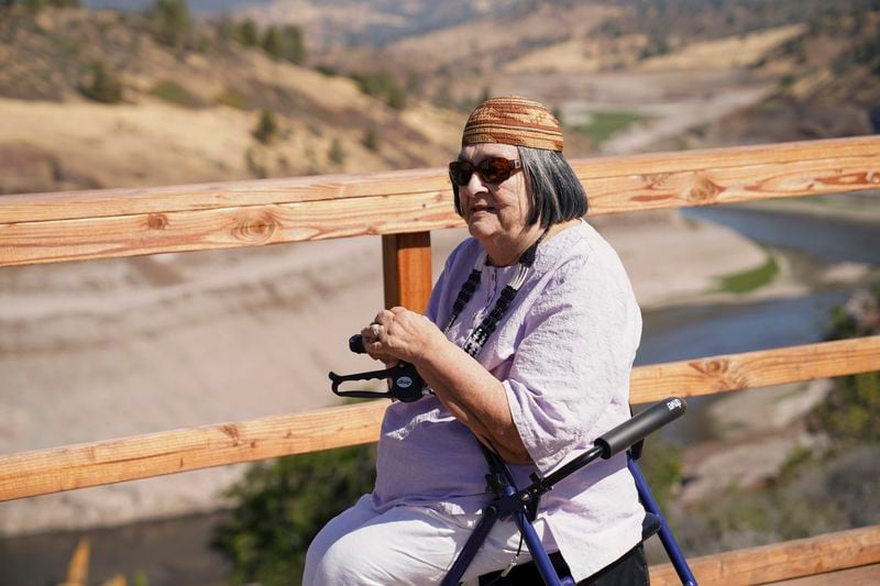 In this image provided by Matthew Johan Mais, Yurok elder Jacqueline Winter poses for a photo near the Klamath River on Aug. 25, 2024, near Hornbrook, Calif. (Matthew Johan Mais via AP)