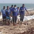 In this image made from video, Djiboutian coast guard workers load bodies of migrants who were washed away on the shore of the Red Sea, off the coast in Djibouti Wednesday, Oct. 2, 2024. The U.N. migration agency says two vessels carrying migrants from Africa sank in the Red Sea killing 45 people. (Djiboutian Coast Guard via AP)