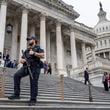 A U.S. Capitol Police officer stands watch as lawmakers leave the House of Representatives after voting on an interim spending bill to avoid a government shutdown next week, at the Capitol in Washington, Wednesday, Sept. 25, 2024. (AP Photo/J. Scott Applewhite)