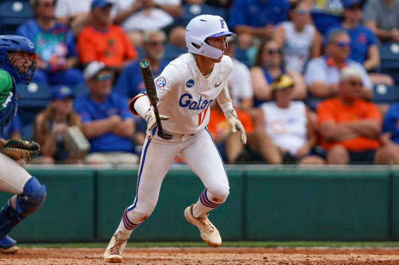 Florida shortstop Skylar Wallace (17) hits a two-run double during an NCAA college softball game against FGCU, Friday, May 17, 2024, in Gainesville, Fla. (AP Photo/Gary McCullough)