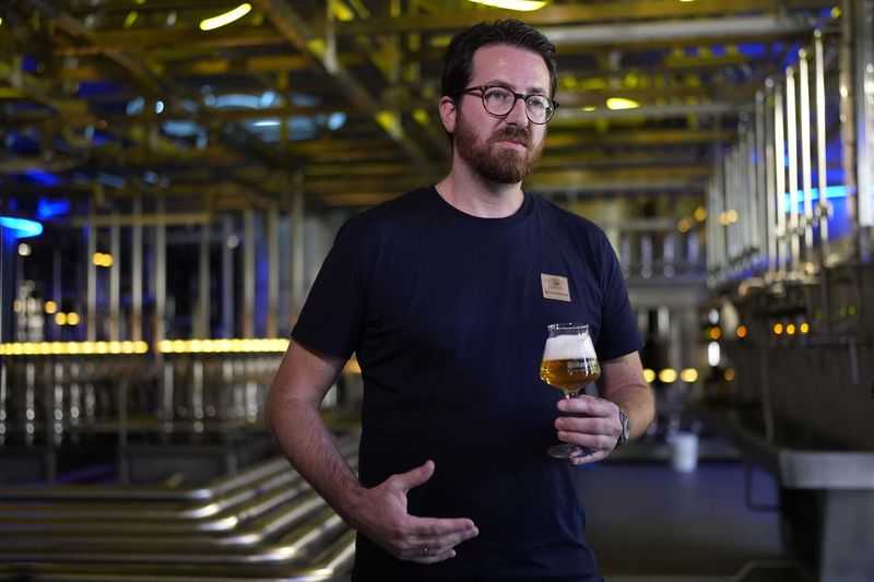 Head Brewmaster Tobias Zollo gestures during an interview with the Associated Press at the Weihenstephan brewery in Freising, Germany, Friday, Sept. 20, 2024. (AP Photo/Matthias Schrader)