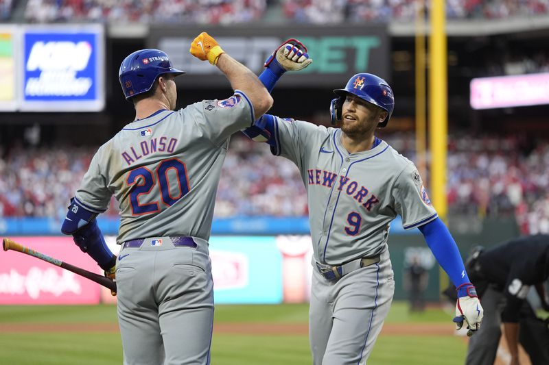 New York Mets' Brandon Nimmo (9) celebrates with Pete Alonso after hitting a home run against Philadelphia Phillies pitcher Orion Kerkering during the seventh inning of Game 2 of a baseball NL Division Series, Sunday, Oct. 6, 2024, in Philadelphia. (AP Photo/Chris Szagola)