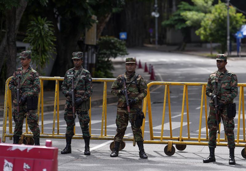 Police commandos stand guard outside a ballot counting center during presidential election in Colombo, Sri Lanka, Sunday, Sept. 22, 2024(AP Photo/Rajesh Kumar Singh)